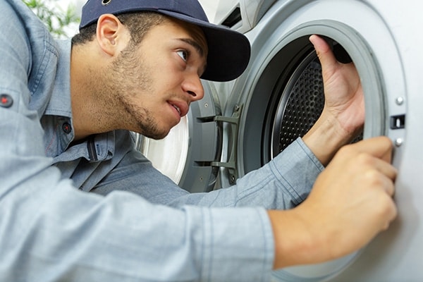 whirlpool front load washer smells